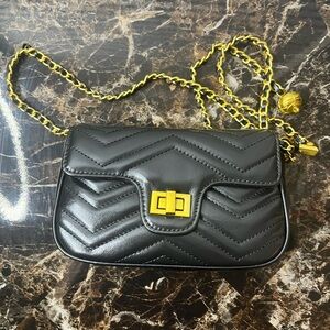 Chic Black Crossbody Bag with Gold Accents